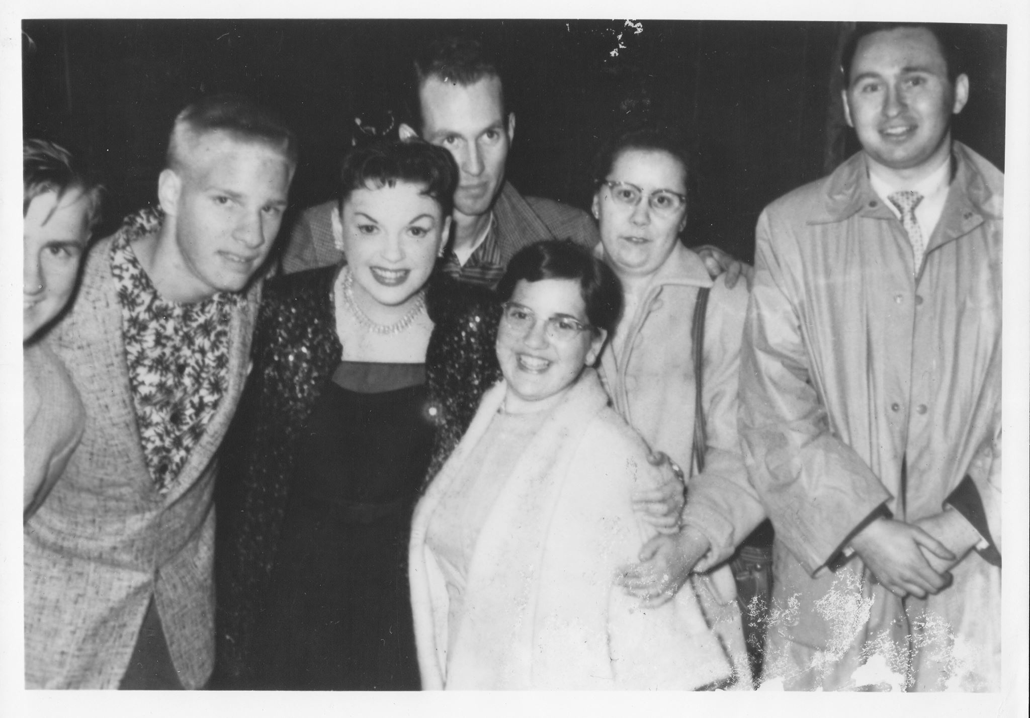 Albert Poland (left) with Judy Garland and her fans, 1957.